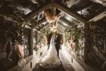 wedding-dress-backlit-glass-corridor