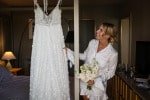 A bride looks at her wedding dress in the bridal suite at Inchydoney Lodge and Spa in West Cork