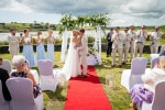 A bride and groom kiss during their their outdoor wedding  at Inchydoney Lodge and Spa