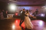 A bride and groom have their first dance in the ballroom at bridesmaid in creative light at Inchydoney Lodge and Spa