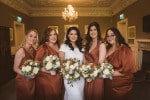 A bride and her bridesmaids holding their bouquets
