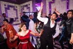 A newly married Indian couple dance together