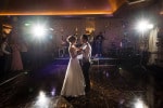 A spotlit bride and groom have their first dance together in the maryborough hotel and spa in Cork