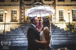 A Bride and Groom embrace at night outside the Maryborough Hotel and Spa in Cork, Ireland