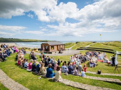 Guests are watching an Inchydoney Lodge and Spa Outdoor Wedding Ceremony